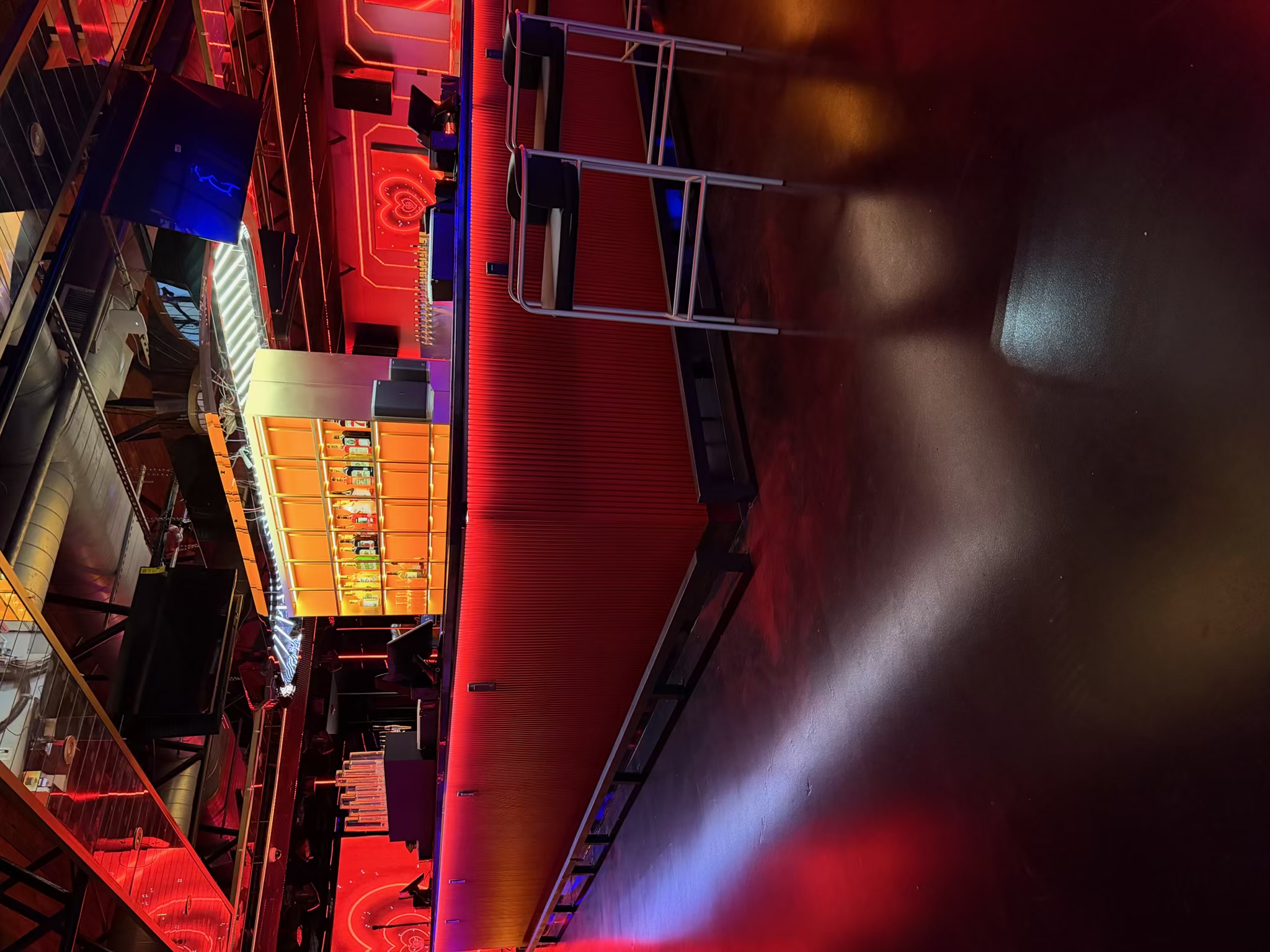 The illuminated bar and lounge seating inside 69 Lounge